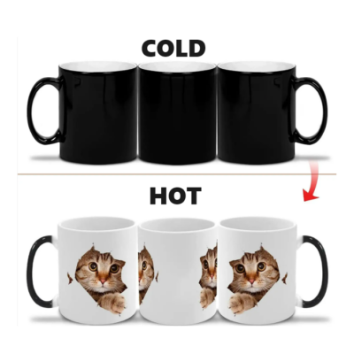 A set of color-changing mugs; black when cold revealing a plain design, and white when hot showing a cat image.